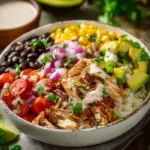 Colorful chicken burrito bowls with fresh toppings and ingredients